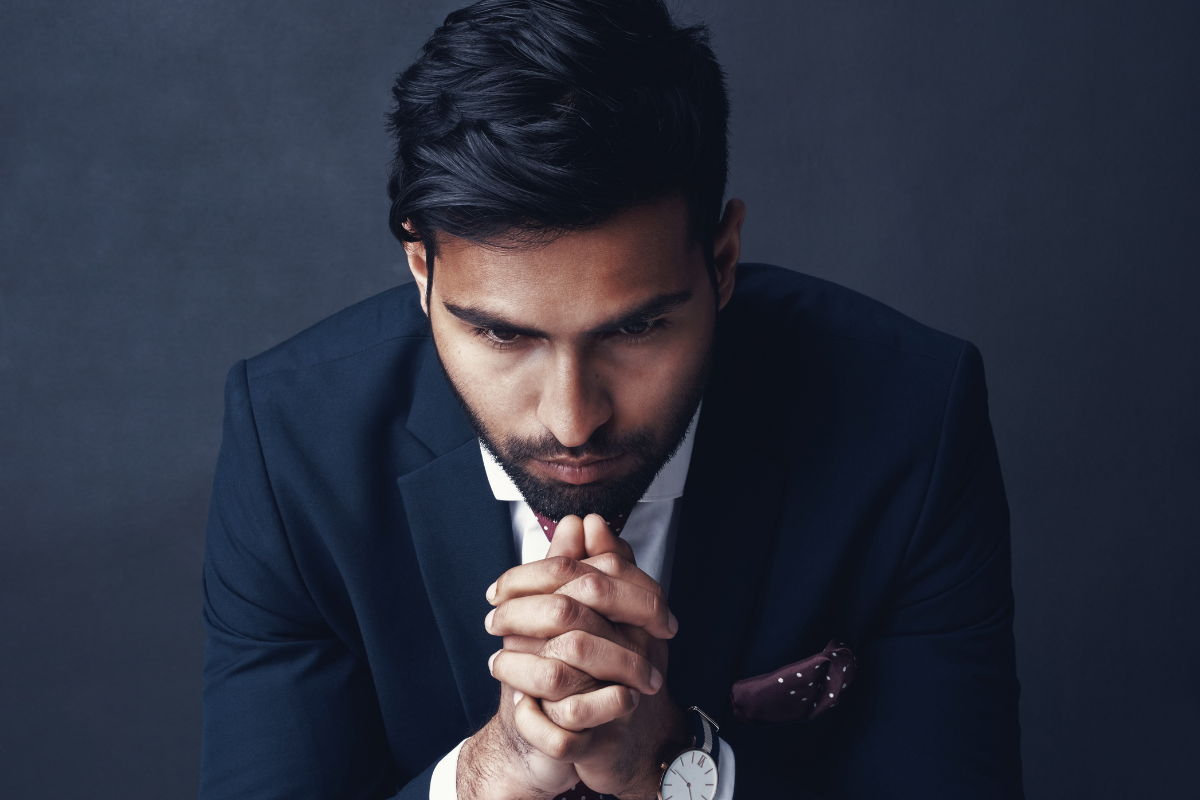 An image of a man looking worried or afraid.