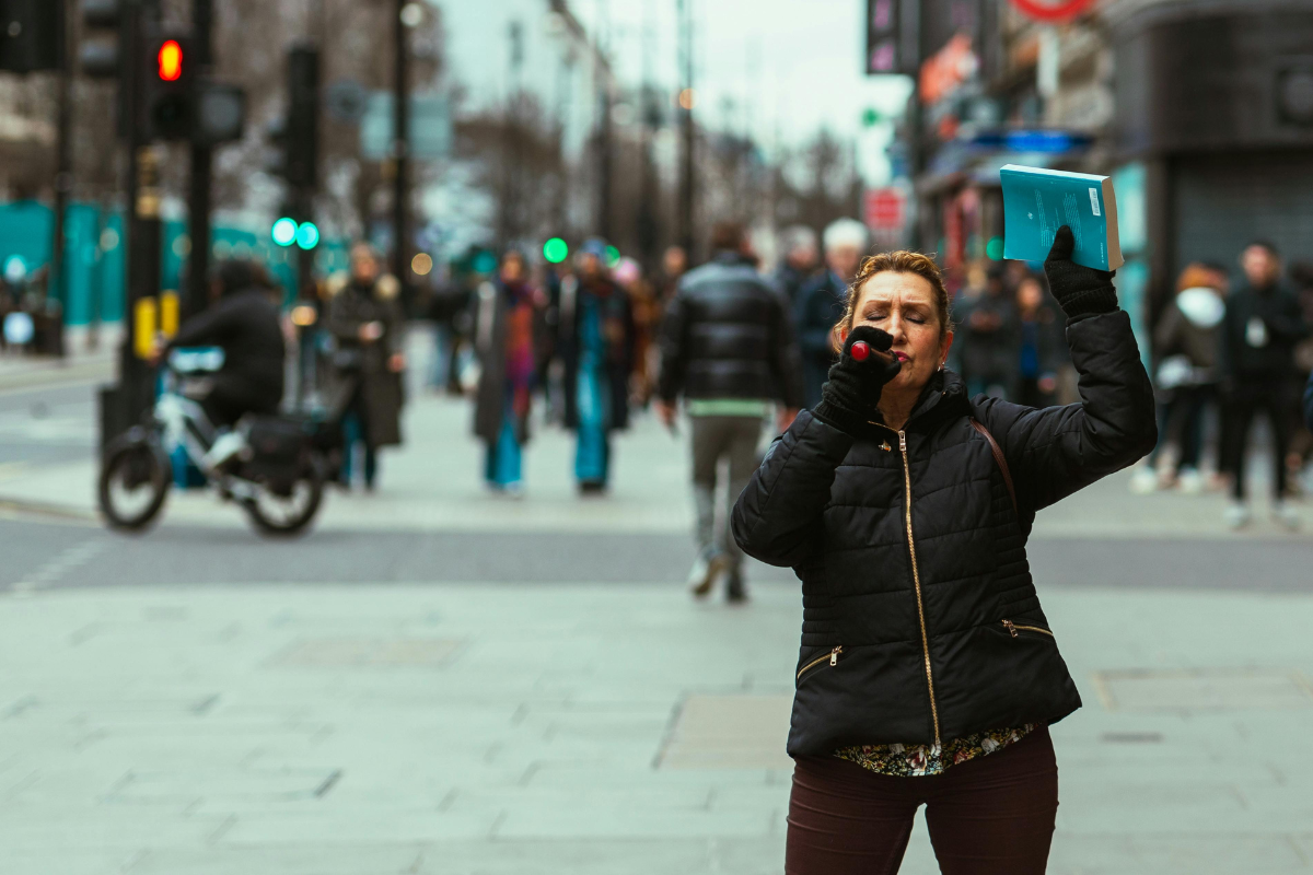 A woman evangelizing on the streets.