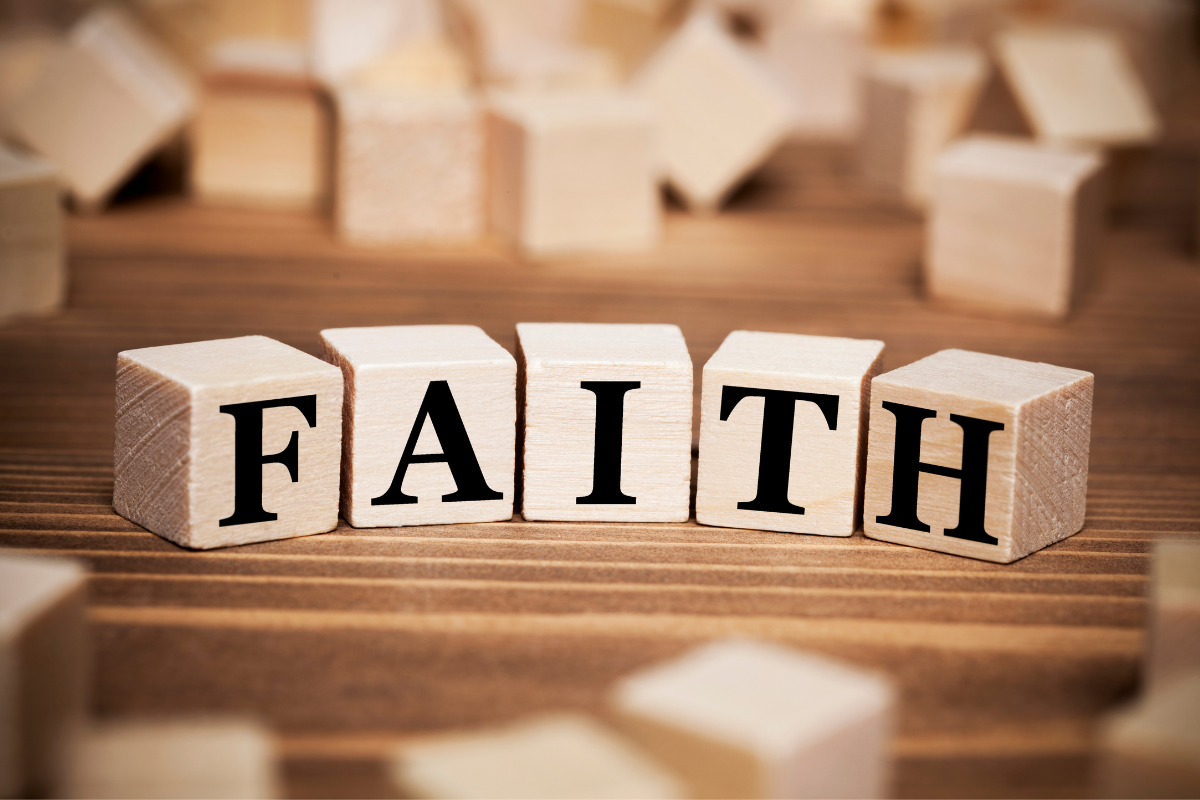 Letter cubes spelling out the word FAITH.