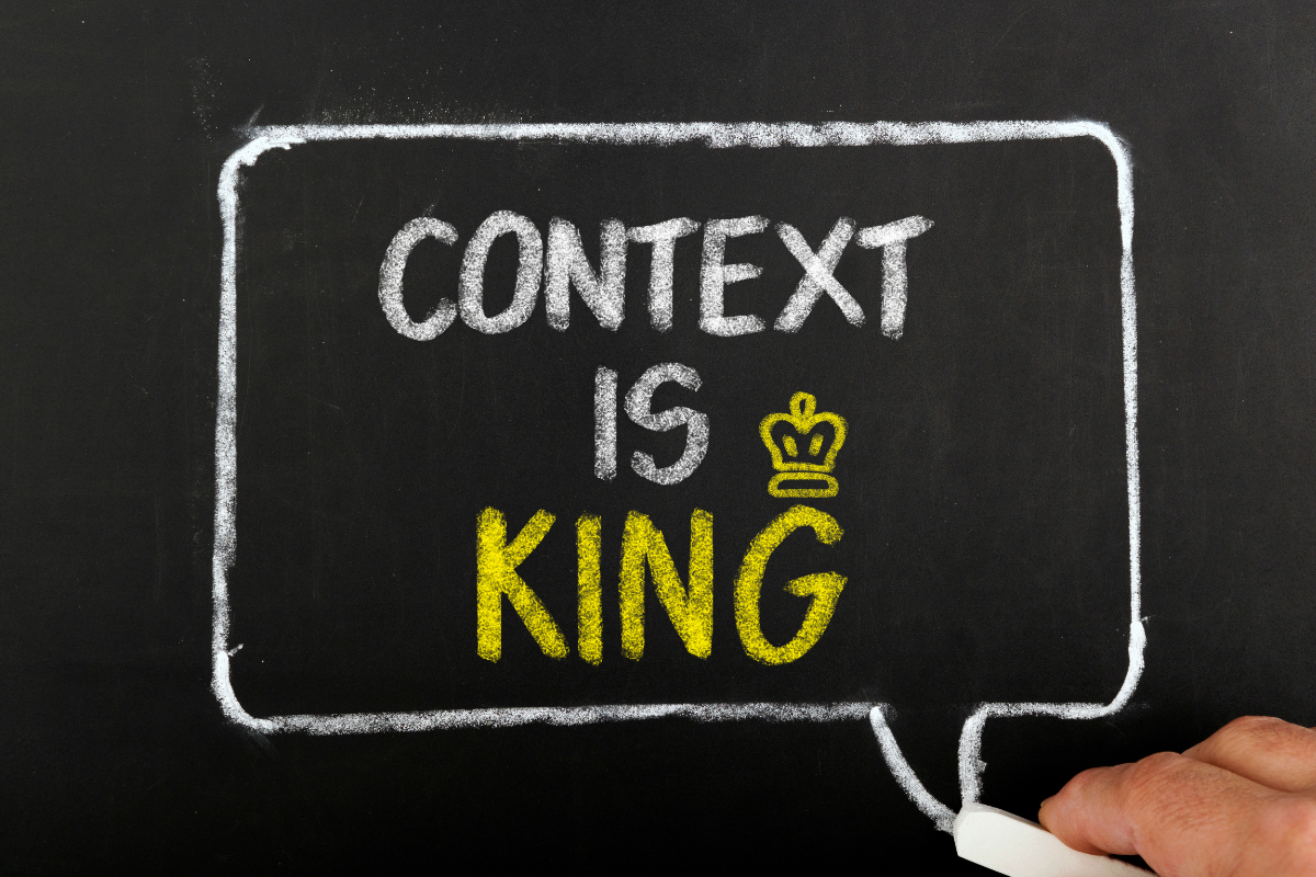A chalkboard with the words CONTEXT IS KING written on it.