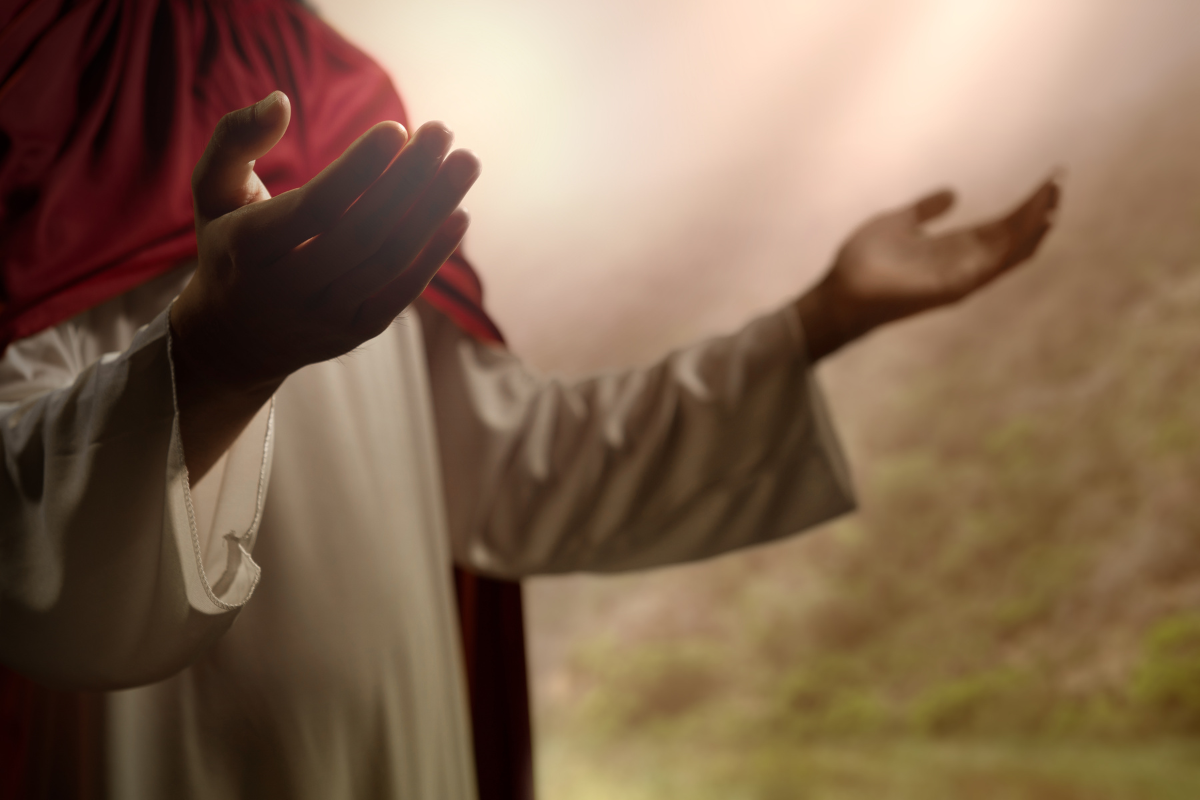 An illustration of Jesus Christ with His hands up in praise.