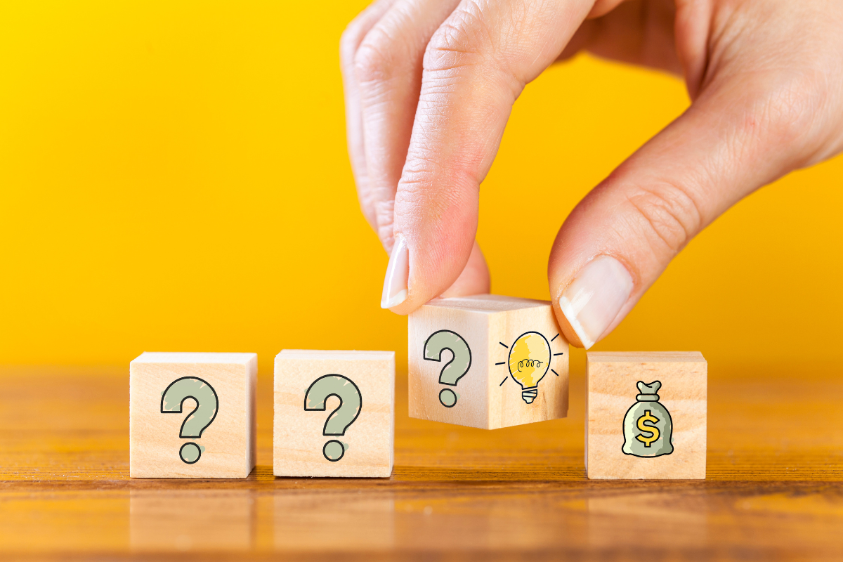 Wooden cubes demonstrating how to solve a problem.