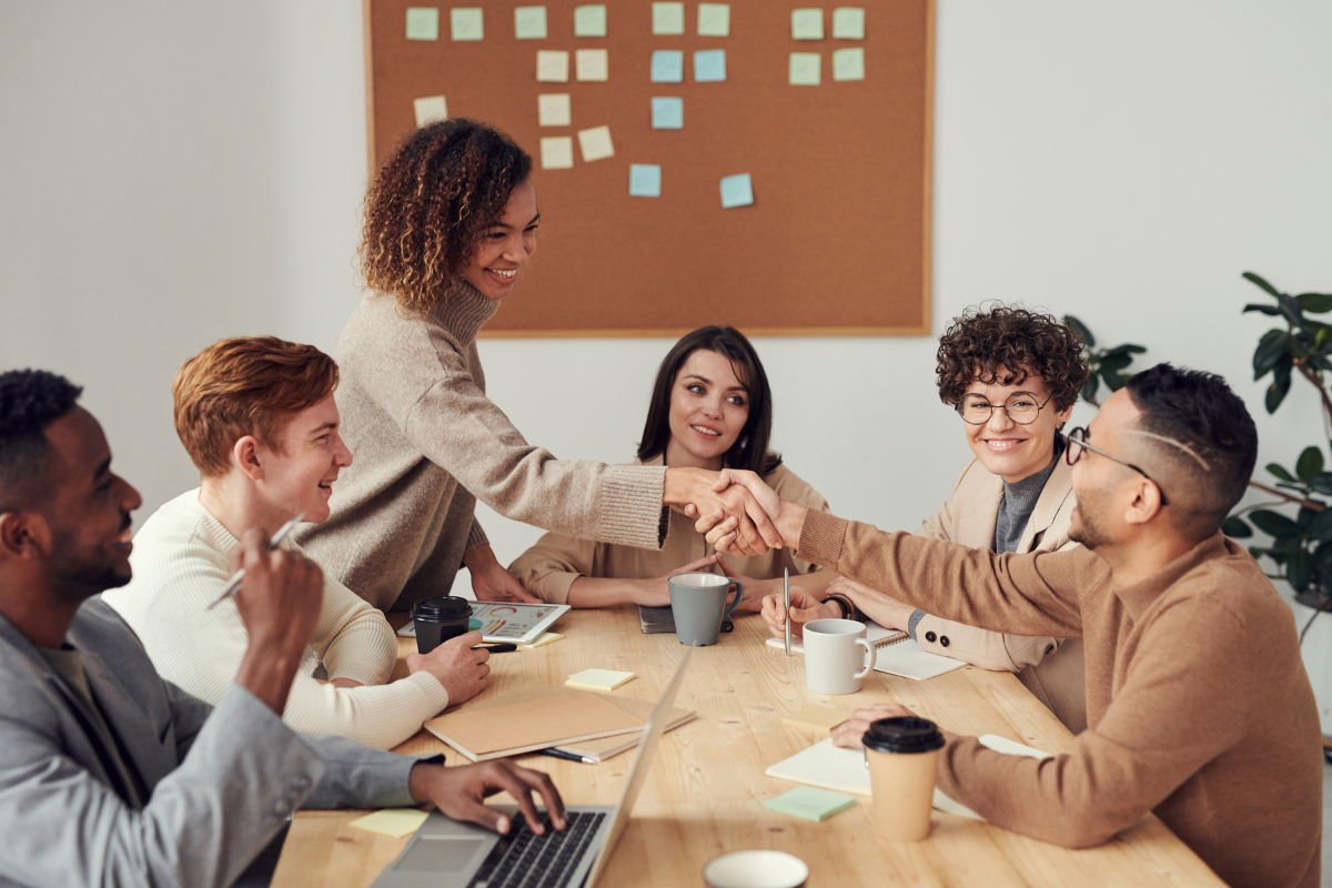 A group of people demonstrating collaboration.