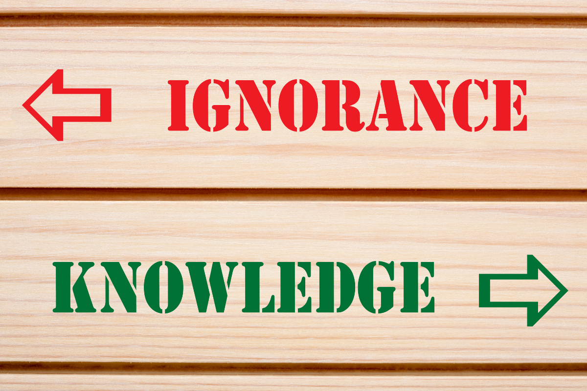 Two arrows pointing in different directions with the words IGNORANCE and KNOWLEDGE.