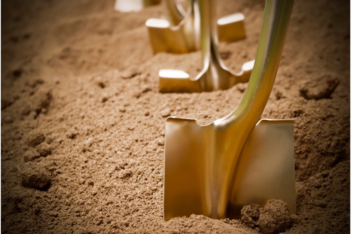 A row of gold shovels.
