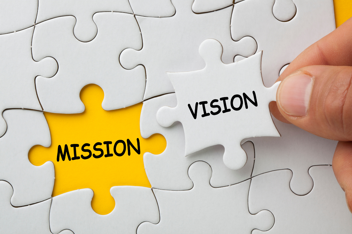 An image of puzzle pieces with the words MISSION and VISION highlighted.