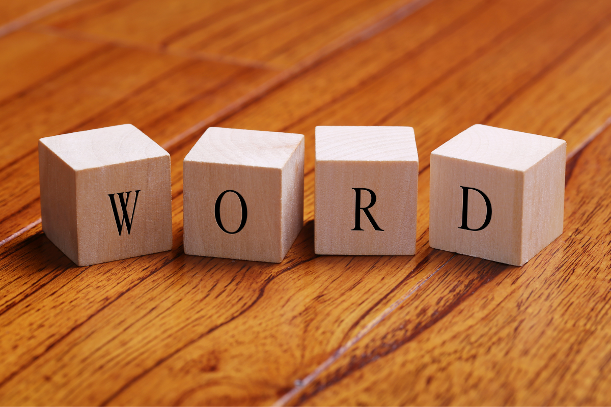 Wooden cubes spelling out WORD.