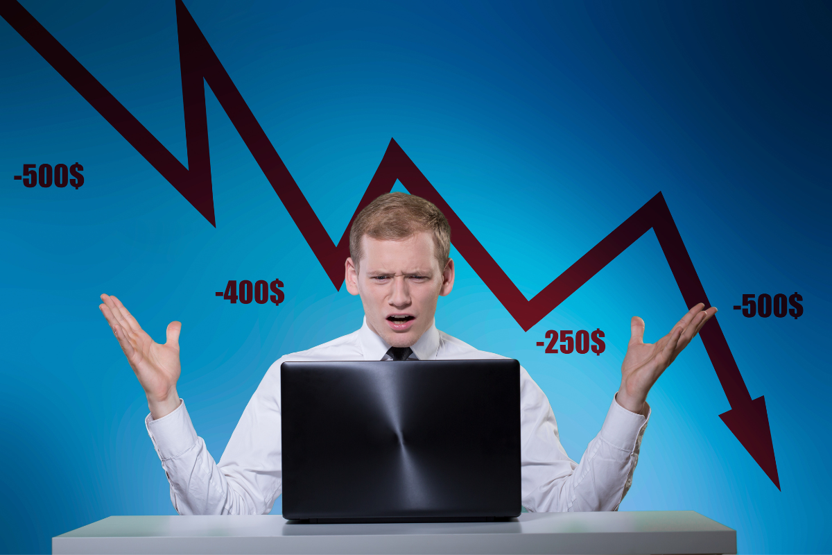 An image of a businessman with projections of profit loss in the background.