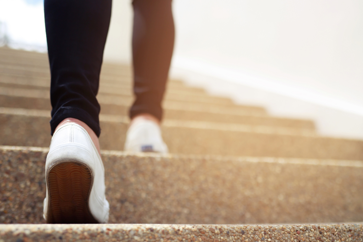 A person going up the stairs.