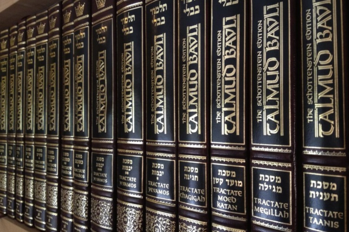 Multiple volumes of the Talmud.