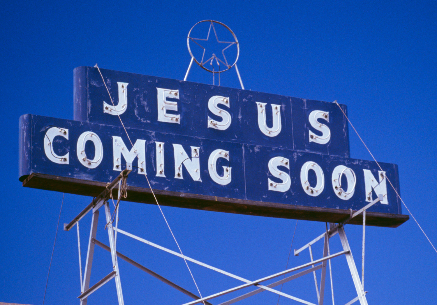 A signage with the words JESUS COMING SOON. 