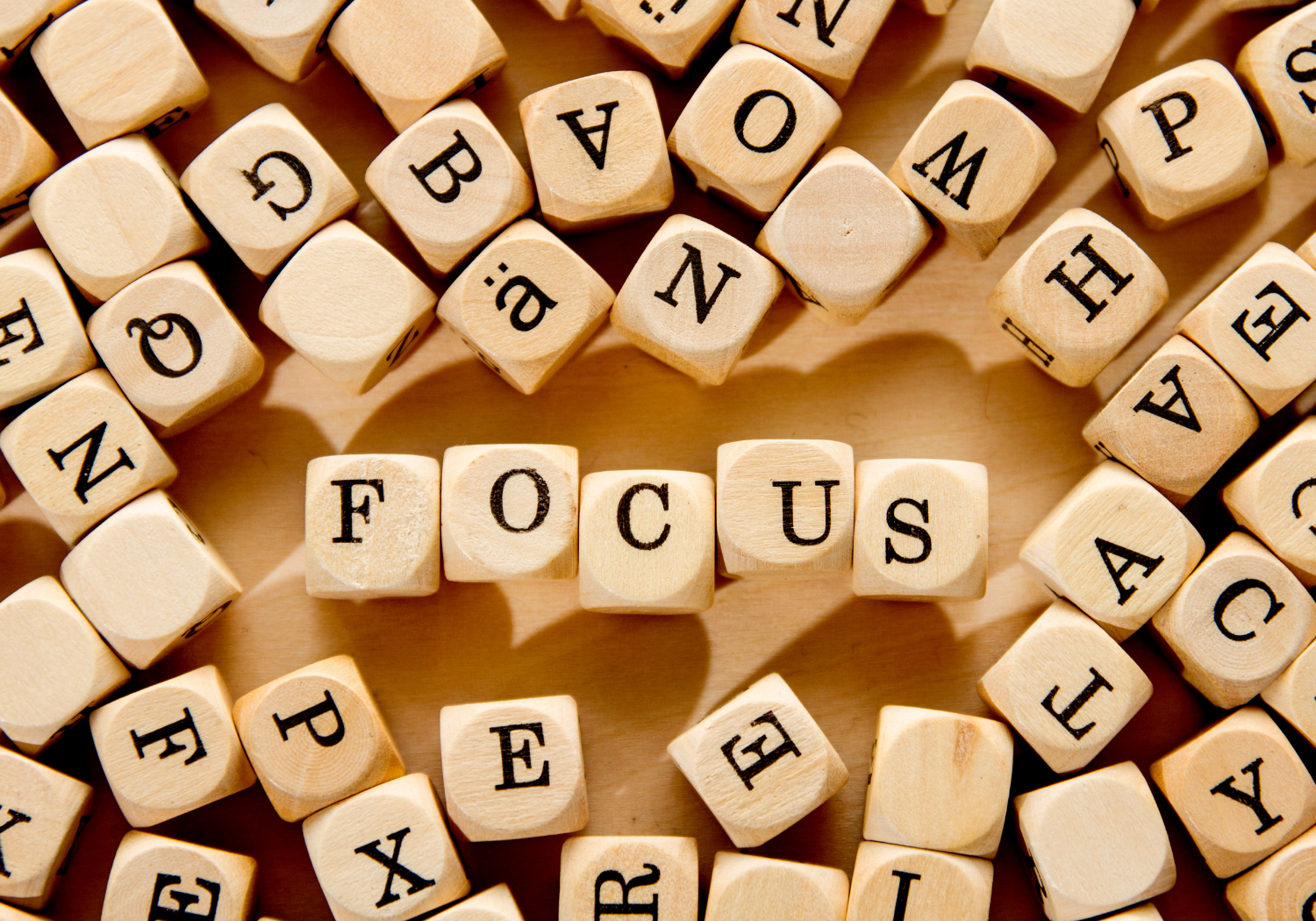 Pieces of word cubes, with the word FOCUS highlighted.