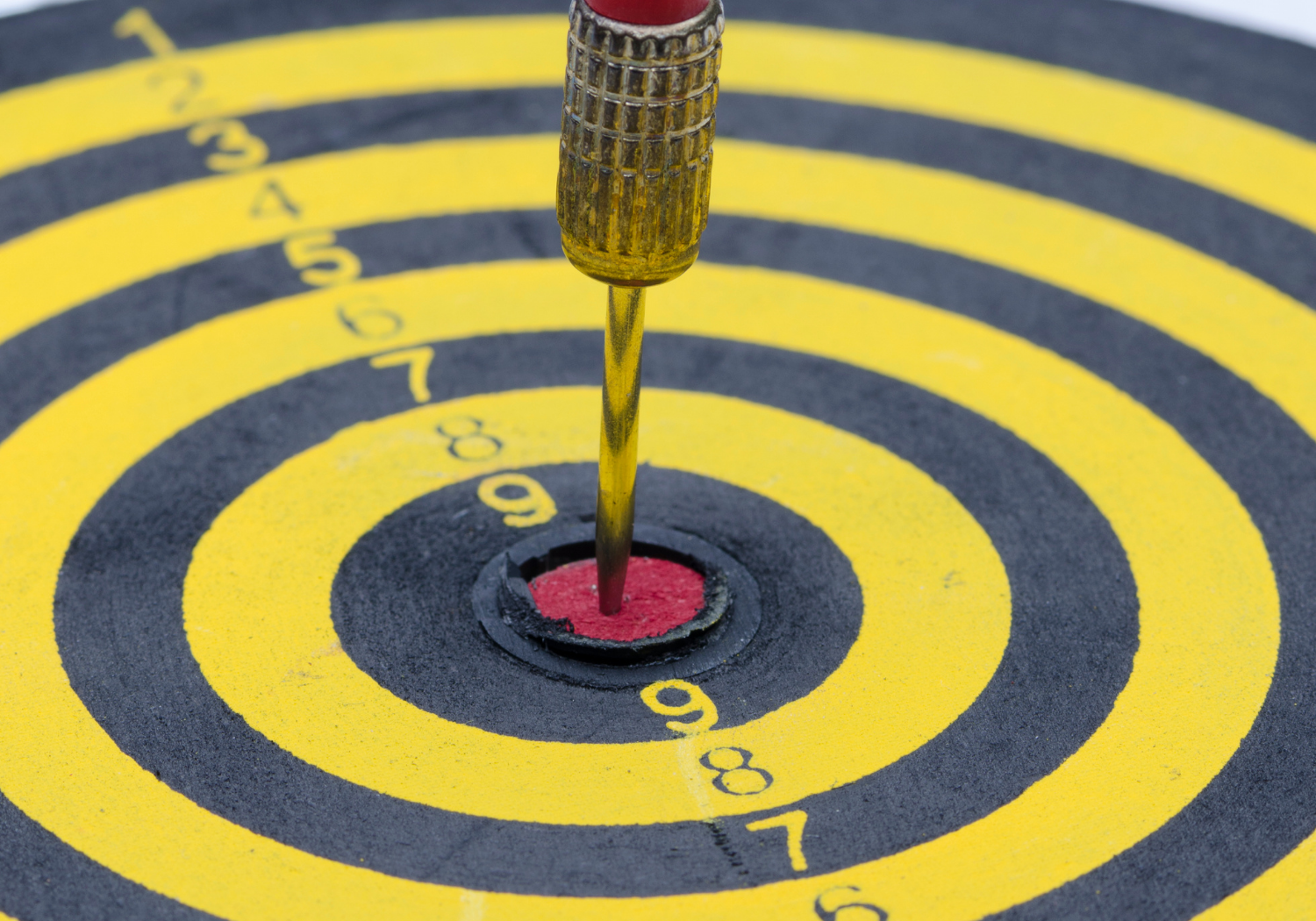 A bullseye hit on a dart board.