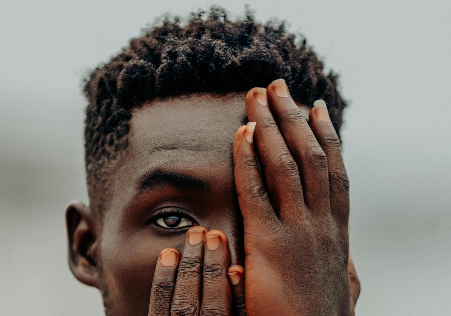 A partially visible African man.