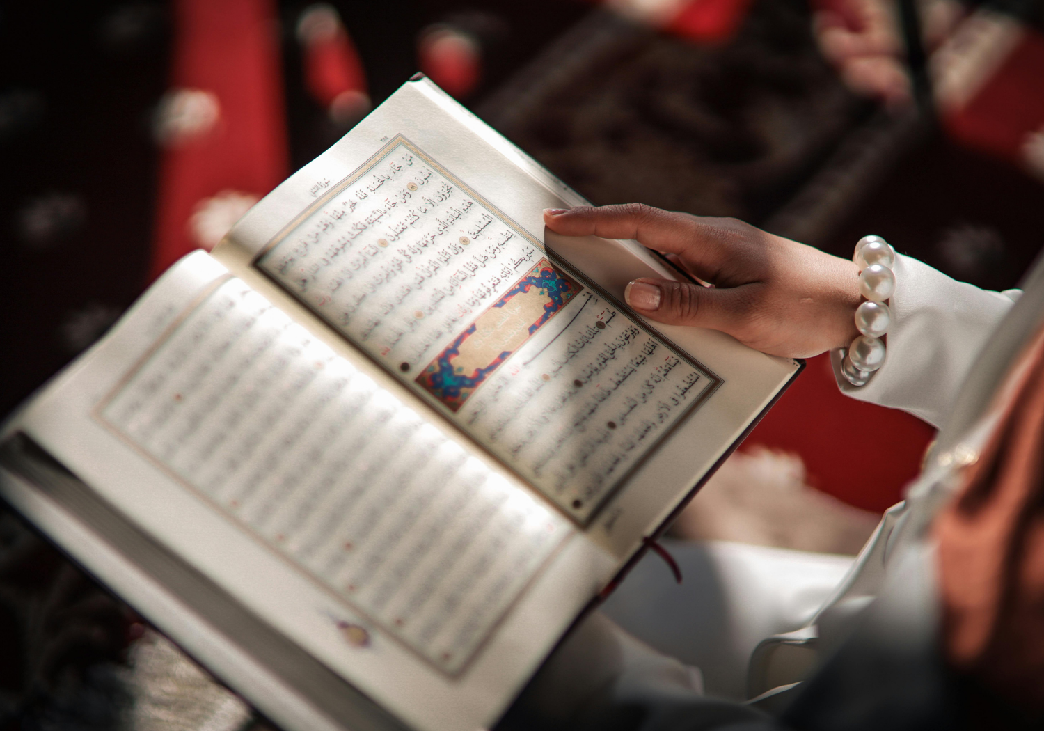 An image of a person reading the Quran.