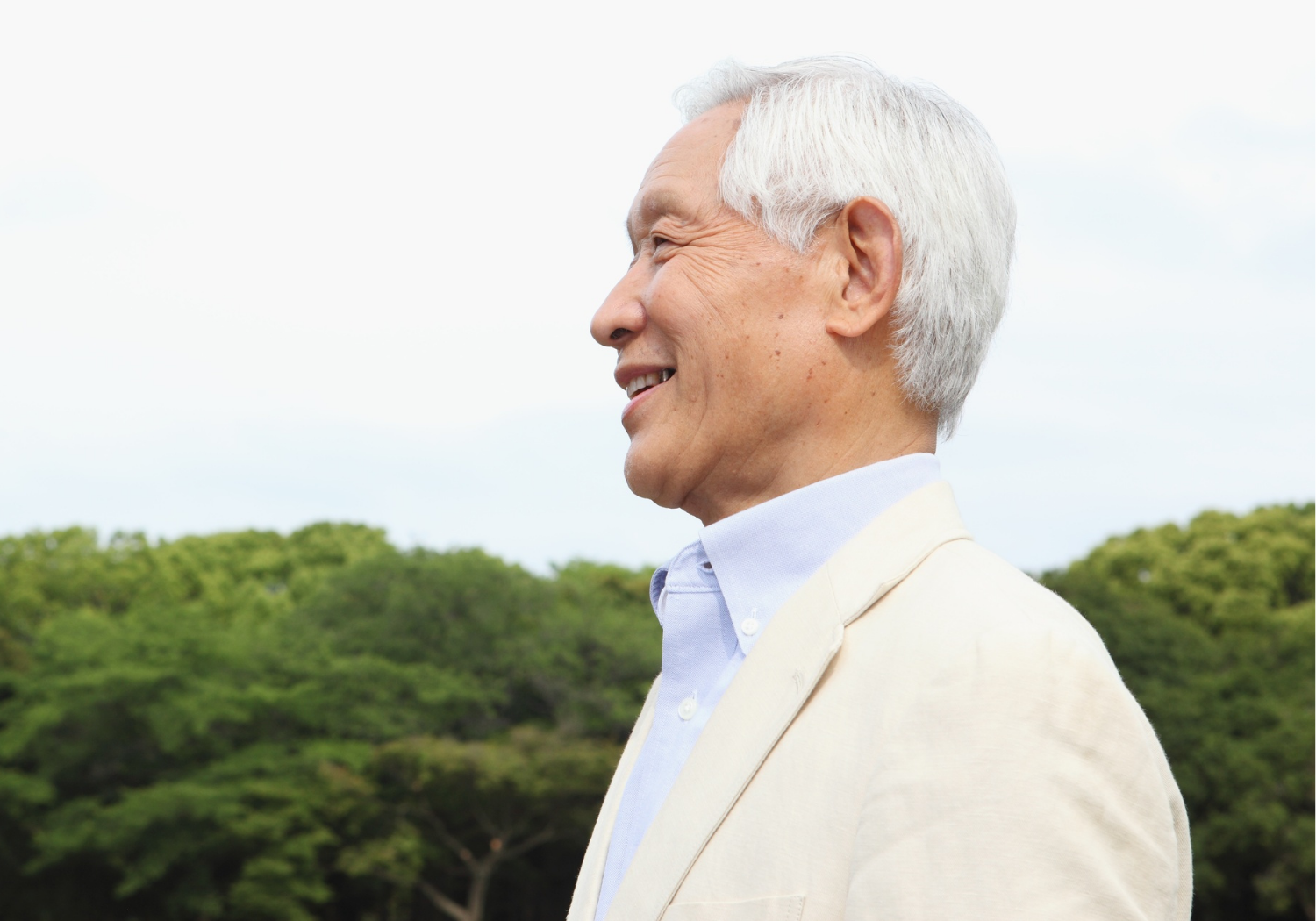 An Asian man with pure white hair.