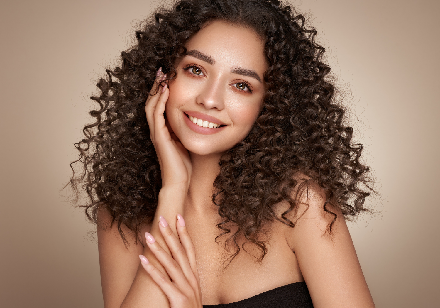 A Hispanic woman with curly brown hair.
