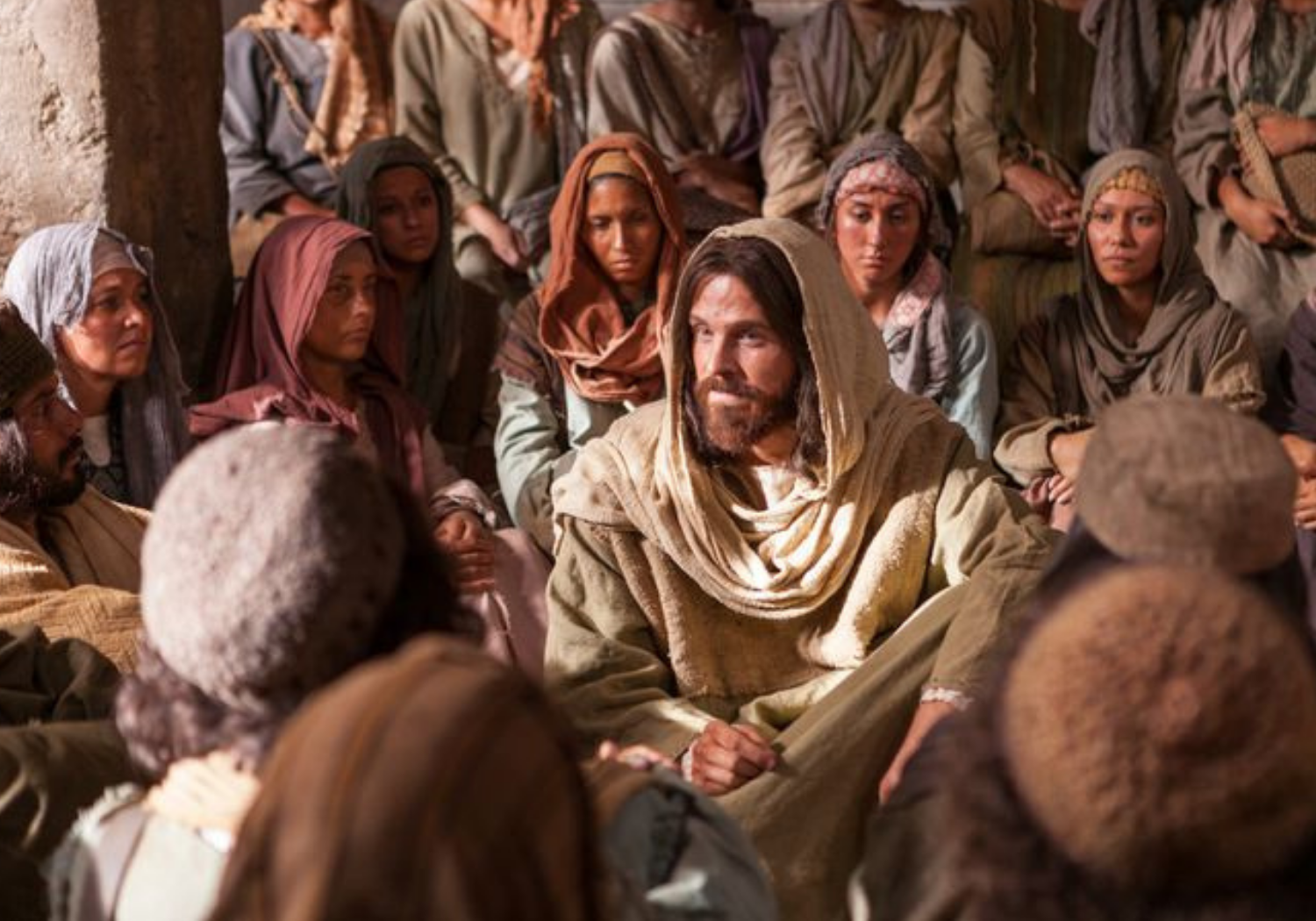 A depiction of Jesus surrounded by people during early church worship.