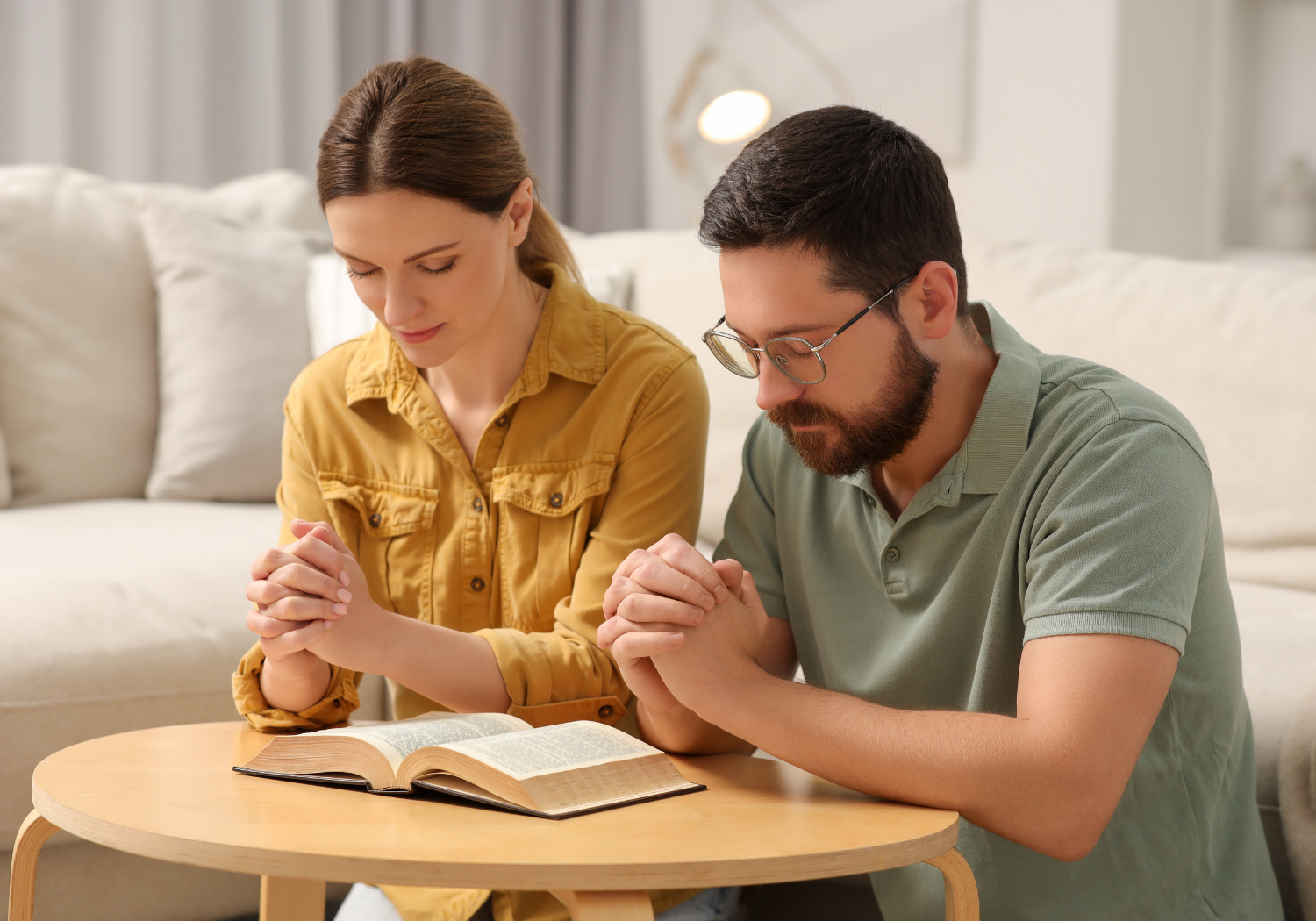 A Christian couple praying together.