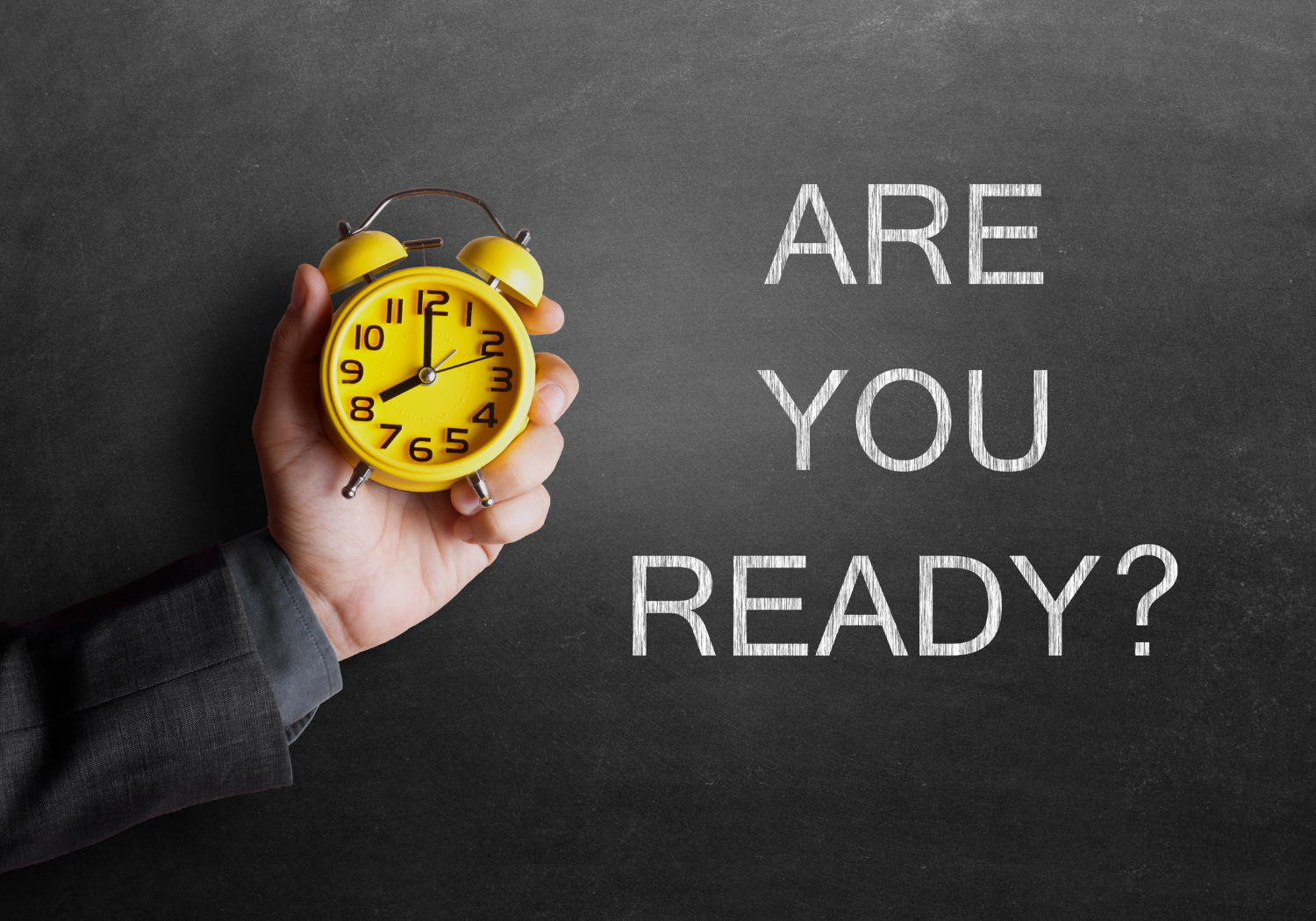 A person holding a yellow alarm clock, with the words ARE YOU READY?