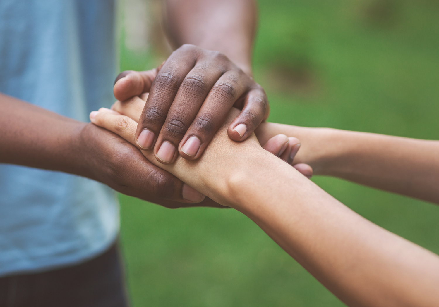 A man holding a woman's hands.