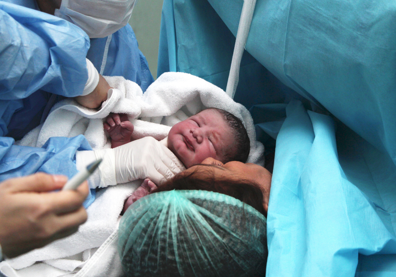 A newborn delivery, symbolizing first breath.