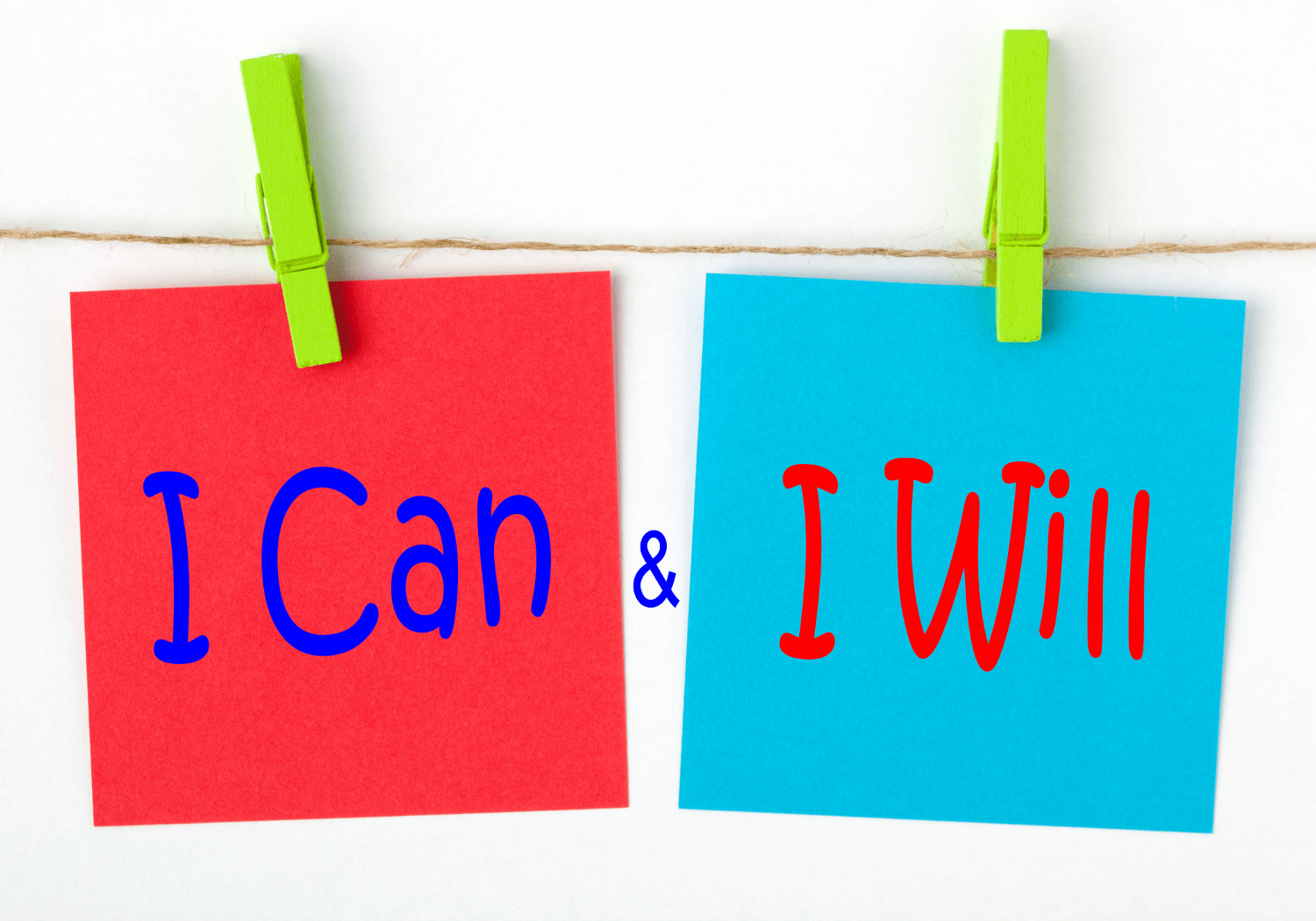 Two sticky notes with the words "I CAN" & "I WILL" written separately.