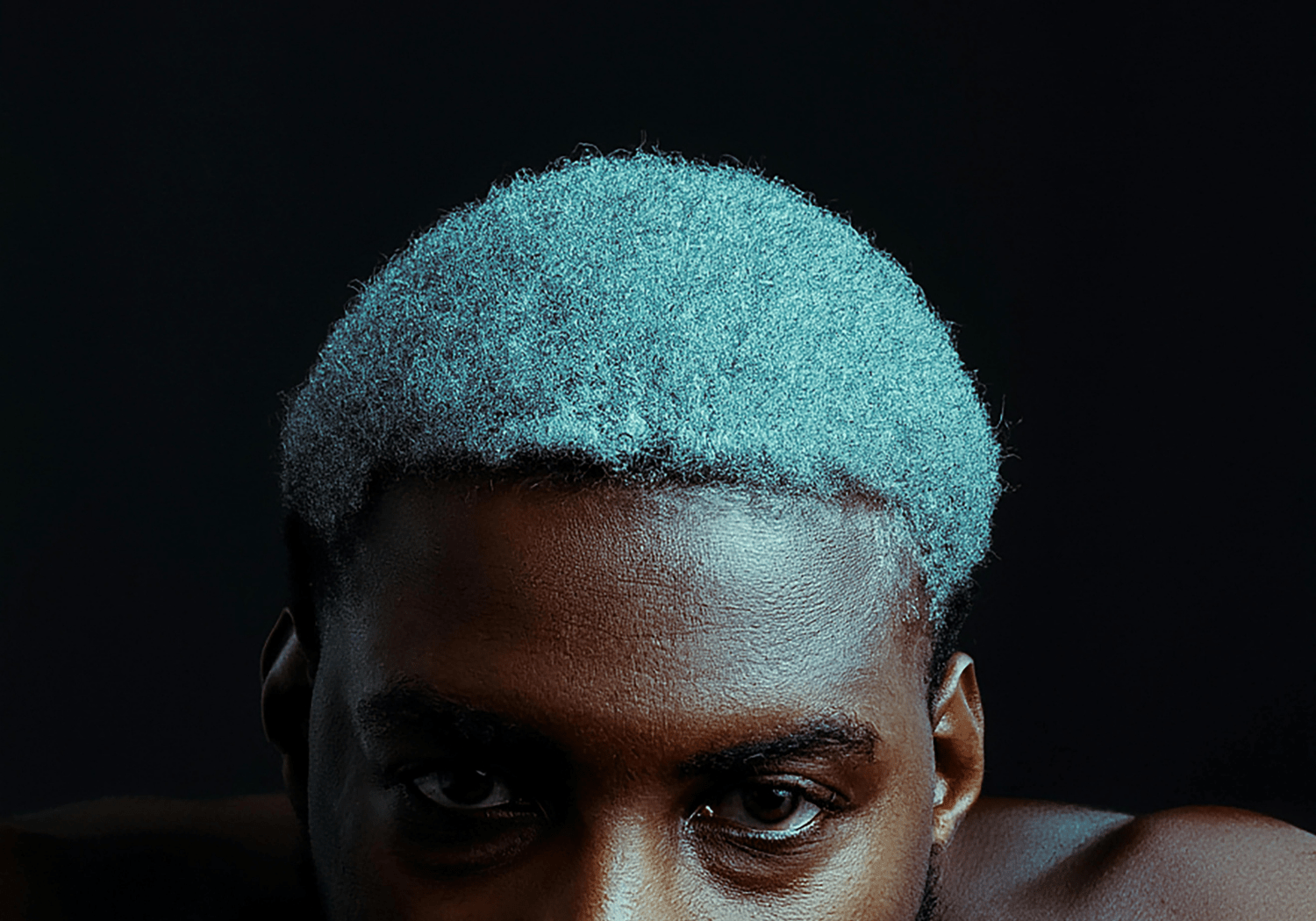 An image of an African man with white wooly hair.