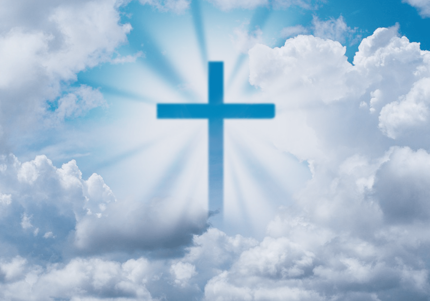 A silhouette of a cross up in the sky with clouds.