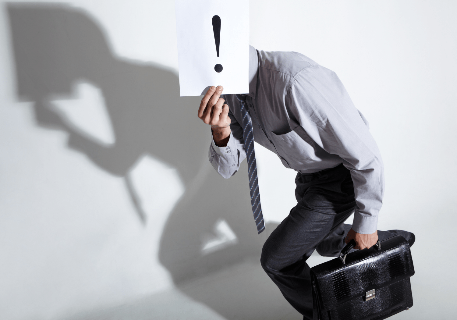 A person hiding his face out of fear.