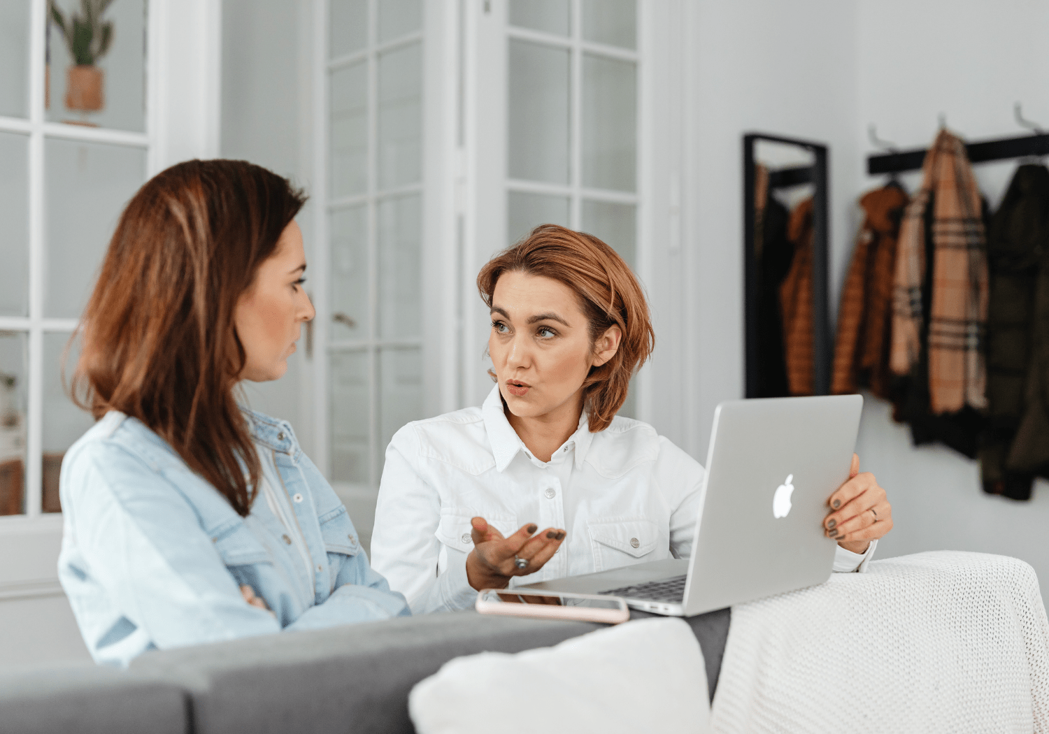 A woman talking to another woman.