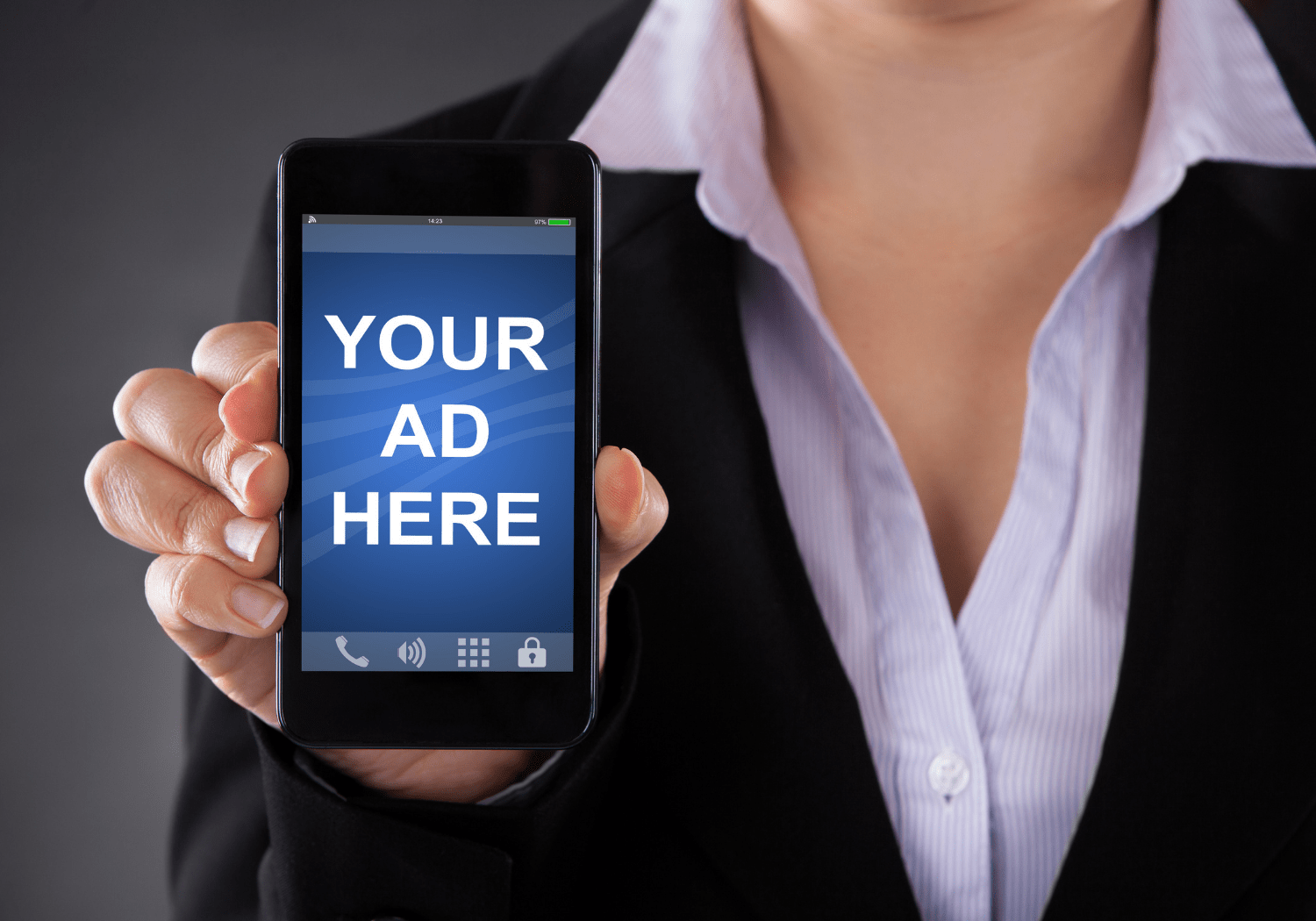A businesswoman, holding up a phone with the words YOUR AD HERE.