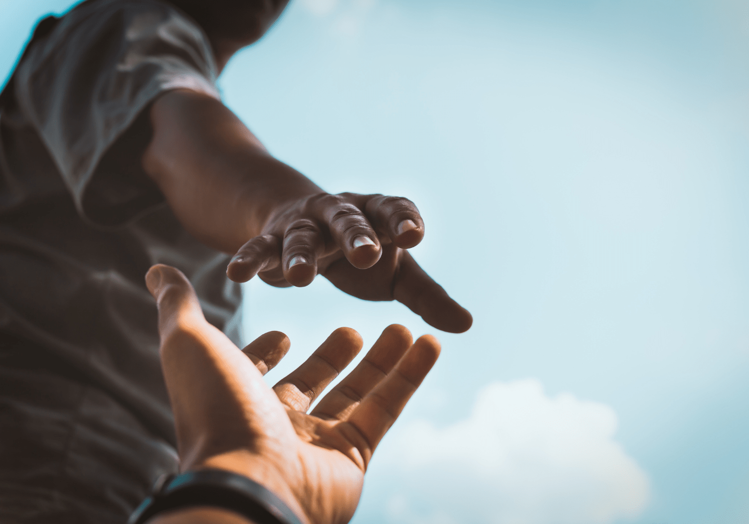 A hand reaching out for another hand.