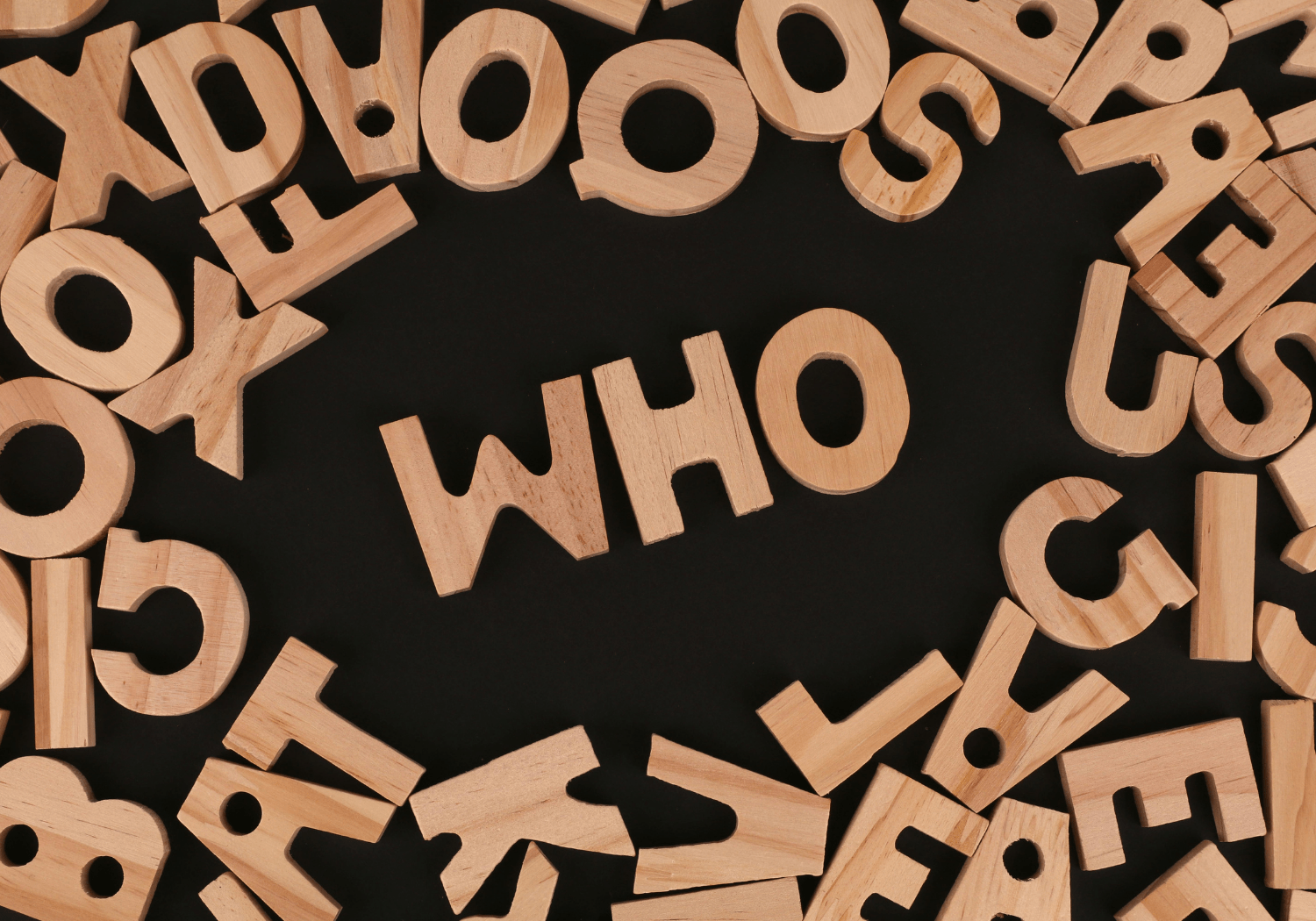Wooden letters spelling WHO.