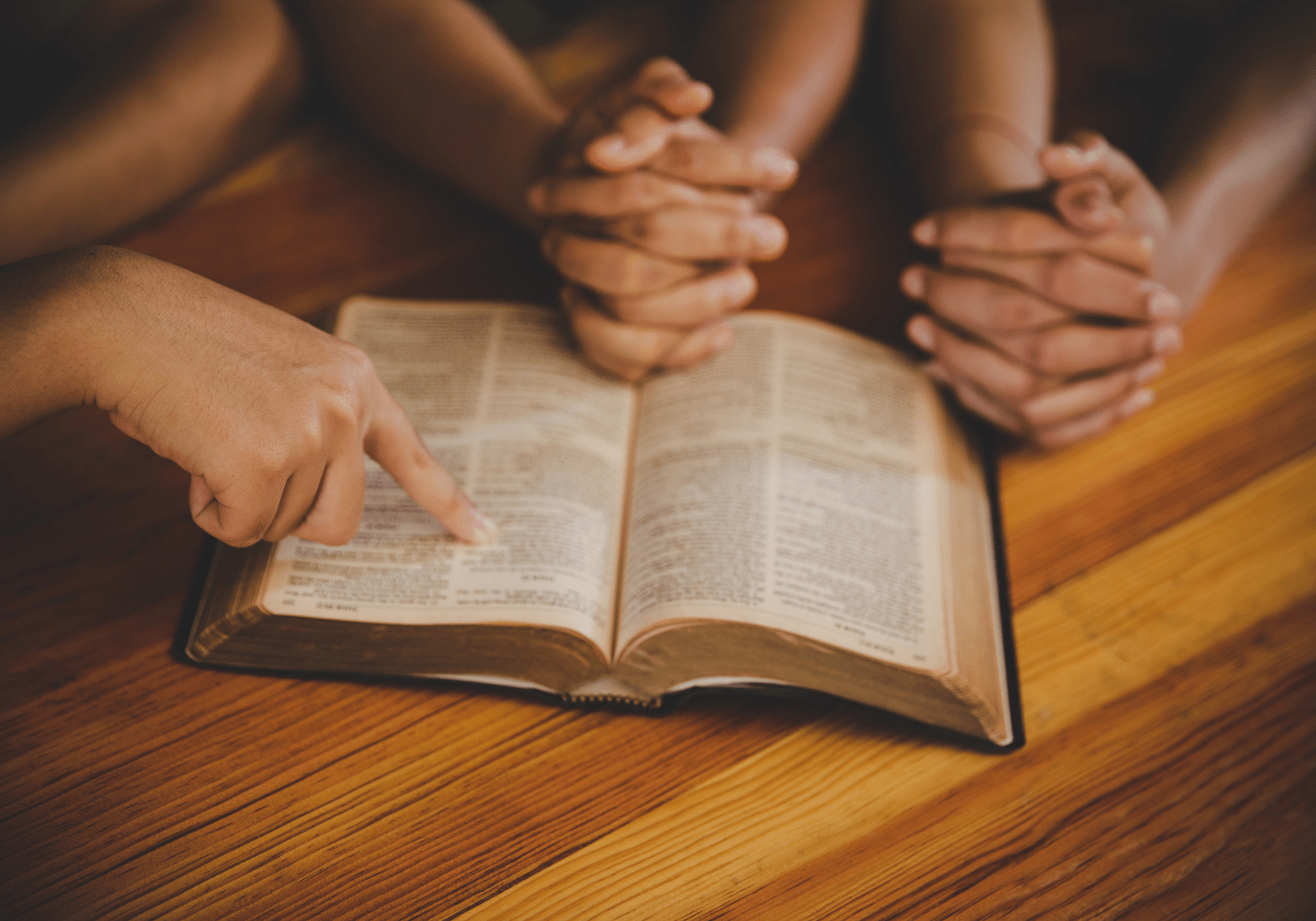 A group of people studying the Bible together.