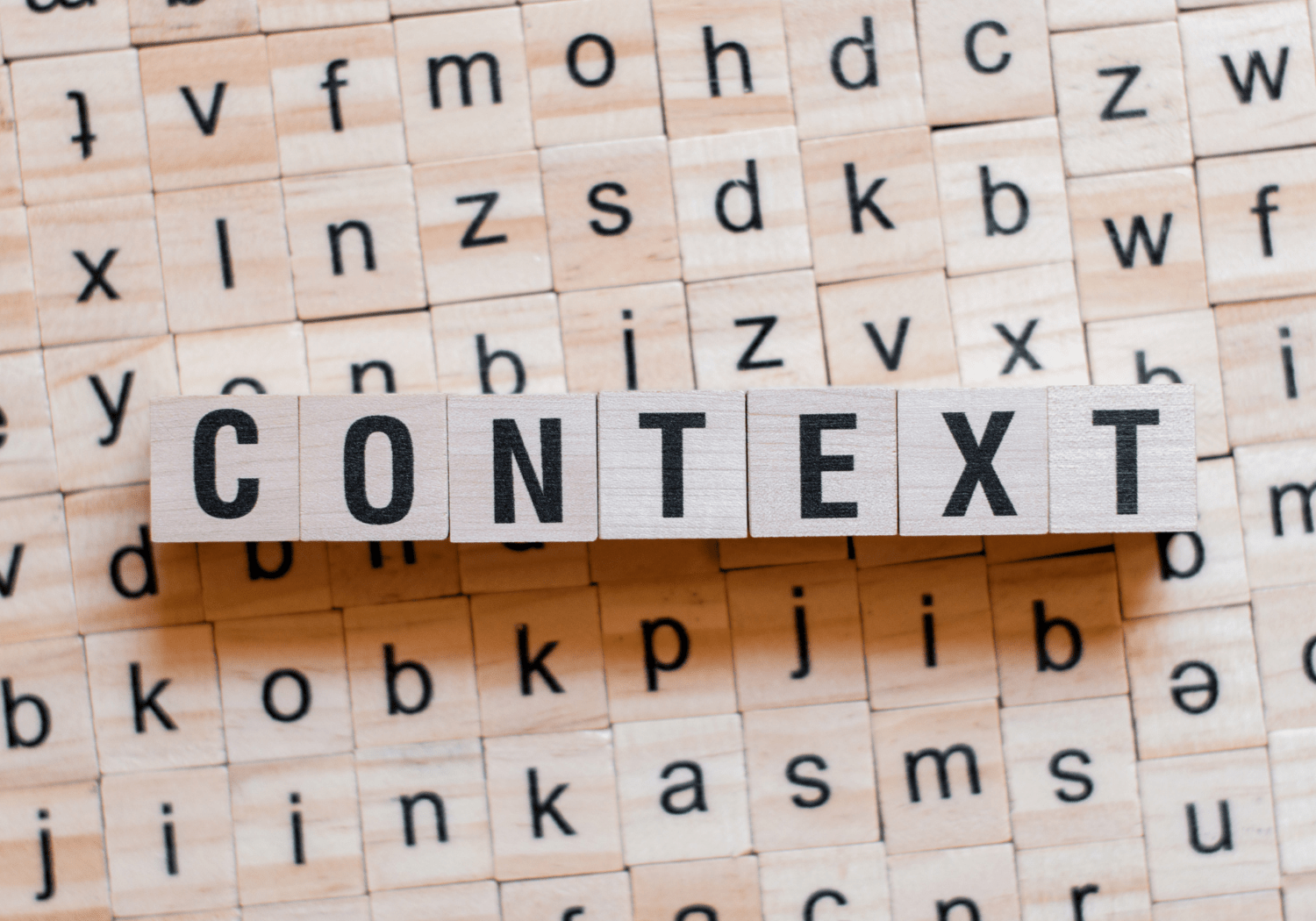 Wooden cubes with the word "CONTEXT" spelled out.